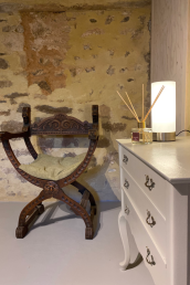 A cosy sit corner with antique wood carved chair and Queen Anne commode.